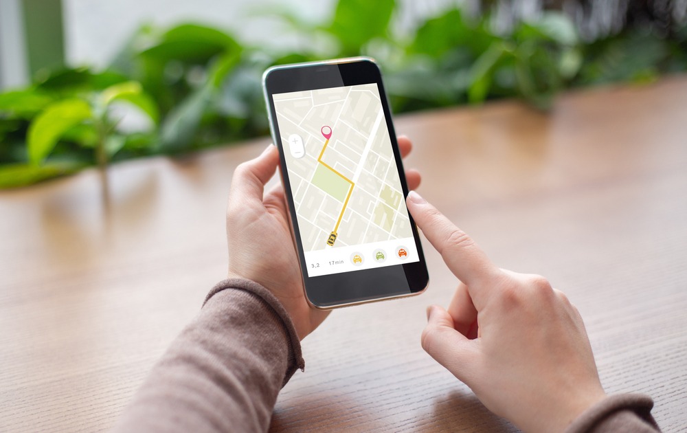 Unrecognizable,Lady,With,Smartphone,Booking,Taxi,Online,Via,Mobile,Application